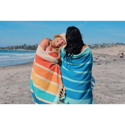 Colorful Neso Beach Towel in Stripes, Perfect for Relaxing by the Ocean on a Sunny Day
