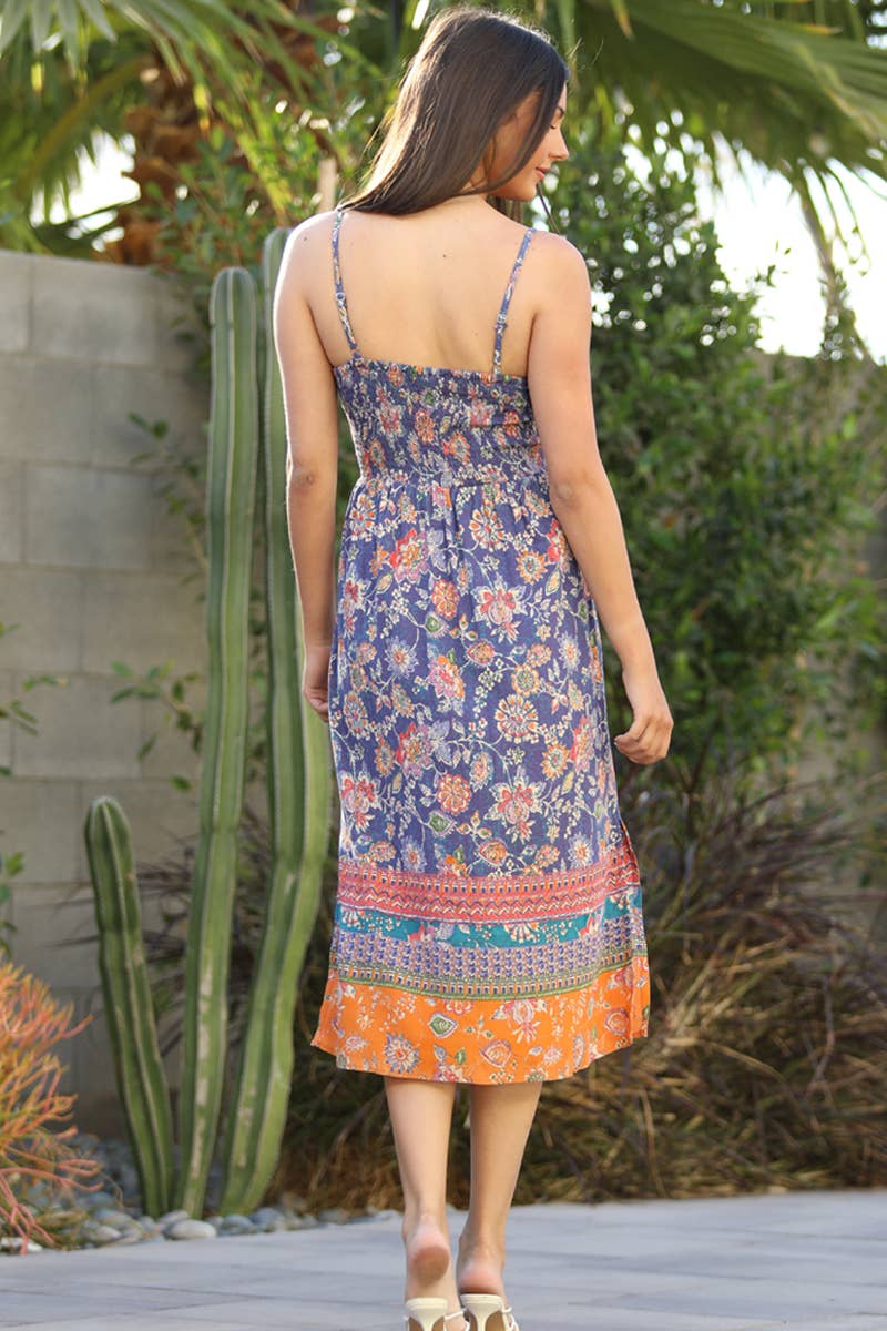 ANGIE boho style summer dress featuring a colorful floral design and adjustable straps