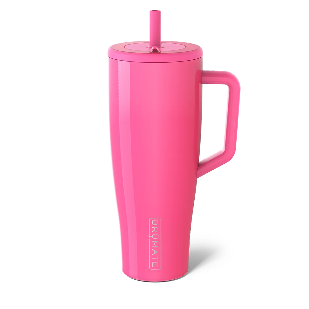 Bright pink Brumate insulated travel mug for beach with a straw and sturdy handle