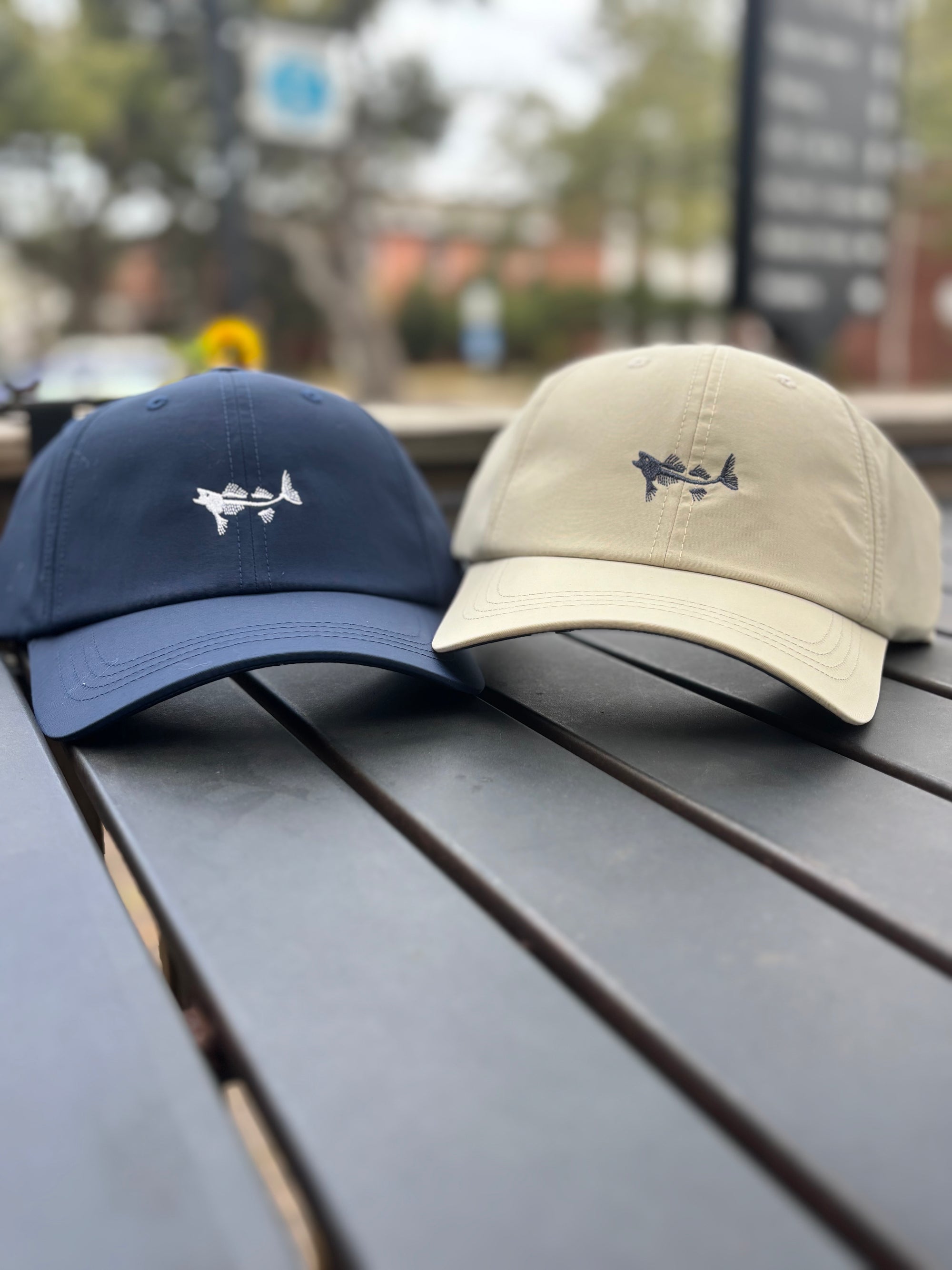 Coastal Cotton trucker hat in navy and tan with embroidered shark design for casual outdoor wear