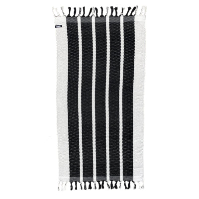 Neso Luxury beach towel in black and white striped design with fringed edges for stylish sunbathing